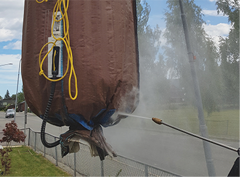 Vask av løftesekk til delvis nedgravd avfallscontainer